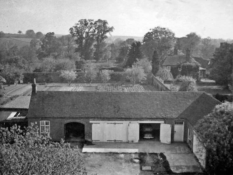 Looking from the roof of Froyle House over the stables, with Froyle Cottage on the right